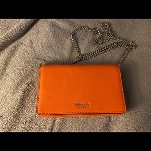KATE SPADE
sylvia leather wallet on a chain.